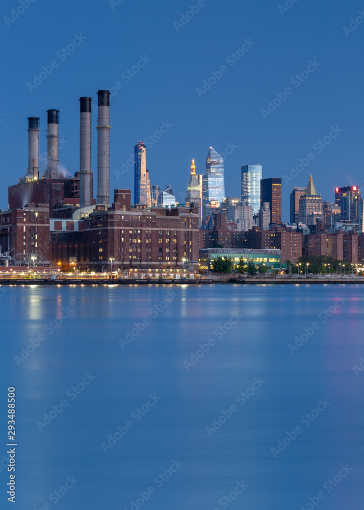 Fototapeta premium View on East Village Manhattan from East river at sunrise with long exposure