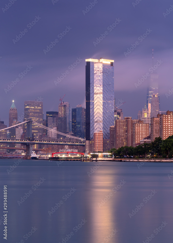 View on Financial District with Two bridges at sunrise with long exposure