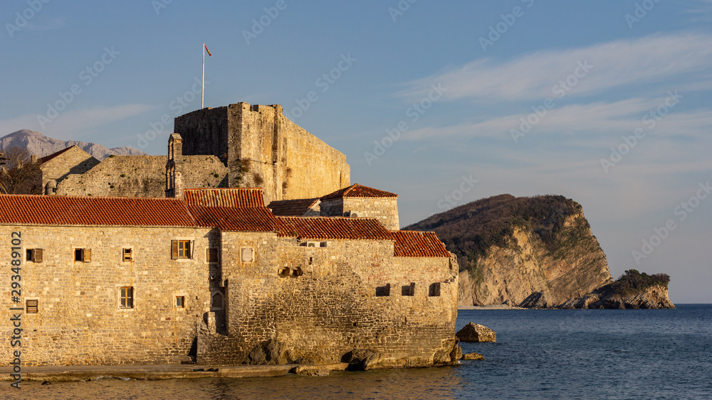 Old Town Budva city walls glow in the afternoon sun