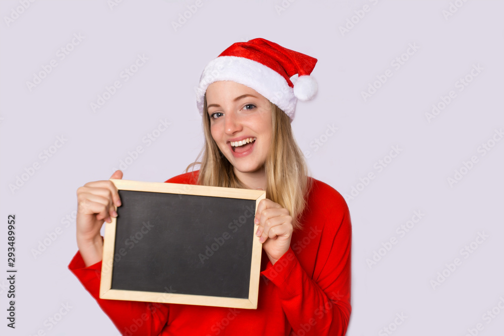 Young woman wearing christmas hat. Young woman wearing christmas hat.