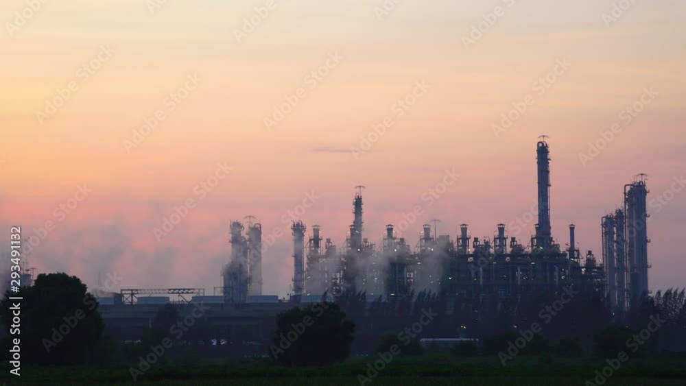 Power plant Billowing steam from smoke stack filling sky. Smoking chimneys from factory. Chimneys of power plant or oil refinery at Sunrise polluting environment. Air Pollution Concept. footage video. Power plant Billowing steam from smoke stack filling sky. Smoking chimneys from factory. Chimneys of power plant or oil refinery at Sunrise polluting environment. Air Pollution Concept. footage video.
