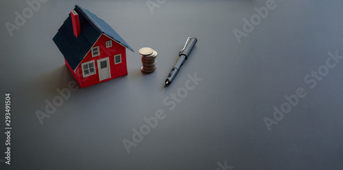Obraz na plátně Real estate and property investment concept with small house model