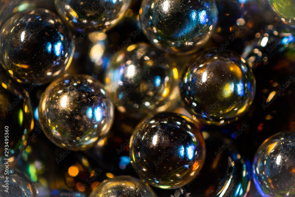 colorful glass marbles on a white background colorful glass marbles on a white background