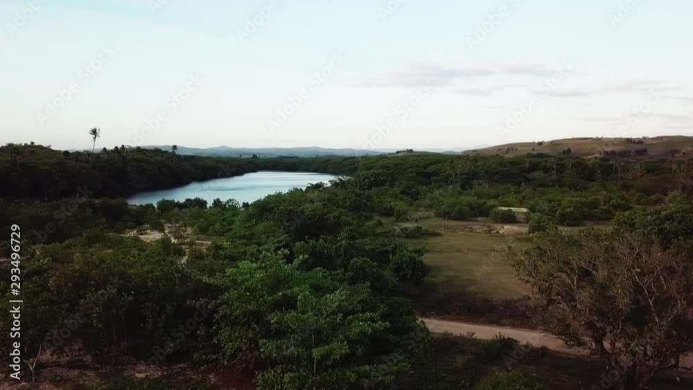 Aerial view of pacific island landscape with lake at dawn Aerial view of pacific island landscape with lake at dawn