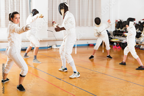 Woman training fencing movements