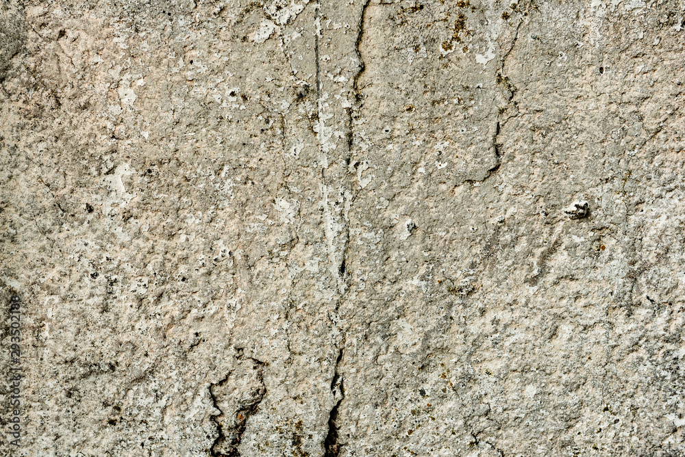 Texture of a concrete wall with cracks and scratches which can be used as a background Texture of a concrete wall with cracks and scratches which can be used as a background