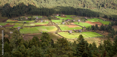 Bhutan village in mountain valley photo