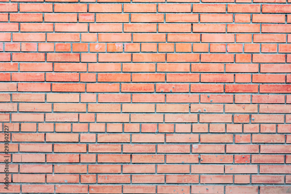 Texture of a brick wall with cracks and scratches which can be used as a background Texture of a brick wall with cracks and scratches which can be used as a background