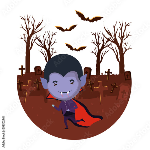 cute little boy with dracula costume in dark cemetery scene