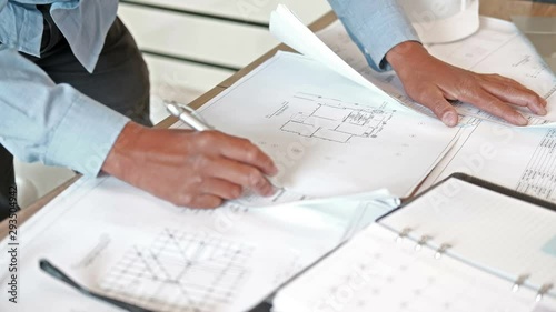 architect engineer working on house blueprint of real estate project at workplace. building construction concept photo