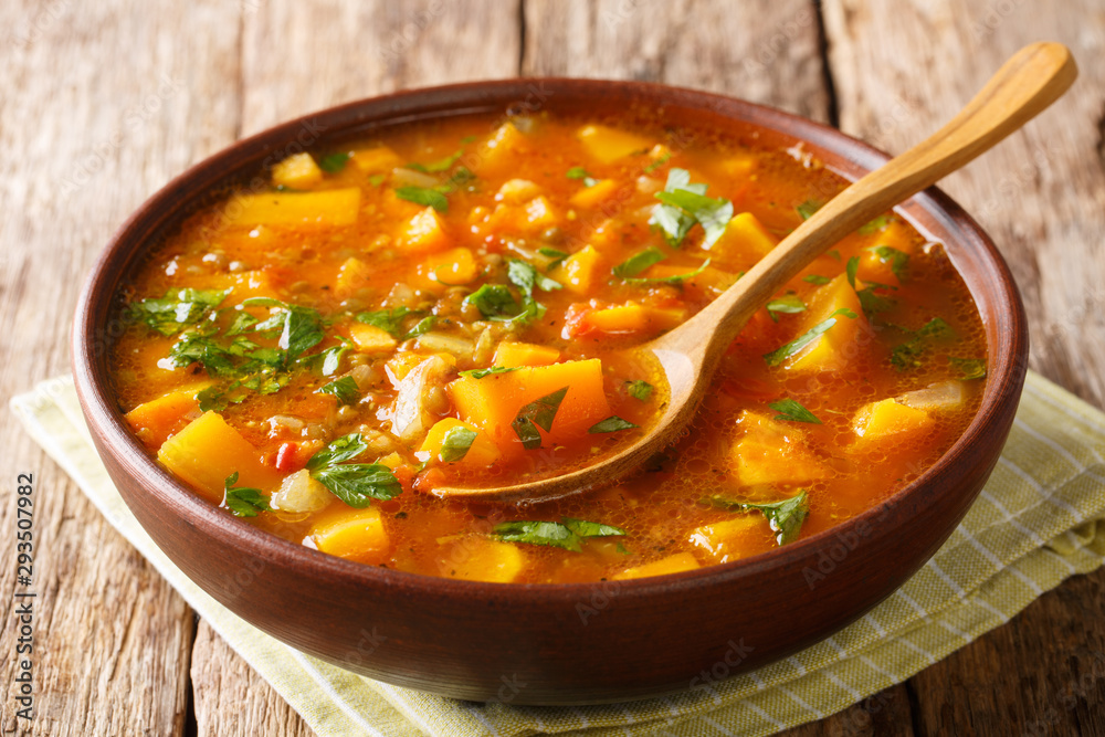 Serving of homemade sweet potato with lentil soup close-up in a bowl. horizontal