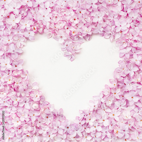 Lilac flowerheads heart shape frame. Floral beautiful border with copyspace. © Mirror Flow