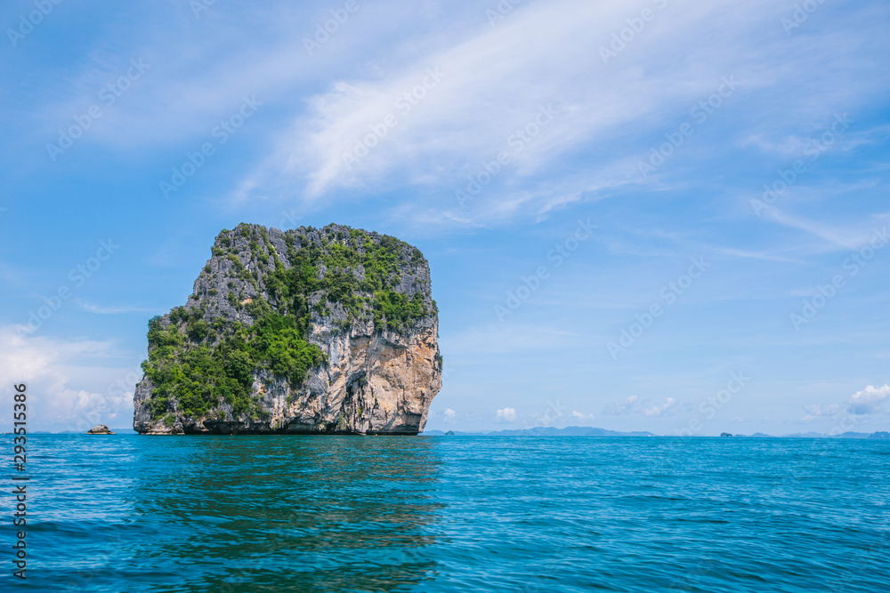 Small limestone island in the ocean, Thailand. 