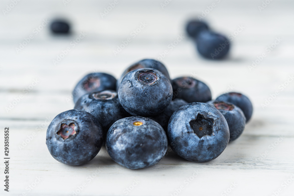 Close up of fresh organic blueberries on white background