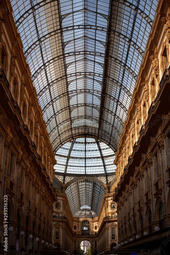 Close up of the Galleria Vittorio Emanuele II interior. This is Italy's oldest active shopping mall, a major landmark of Milan, Lombardy, Italy. It combines Roman ancient architecture & glass ceiling