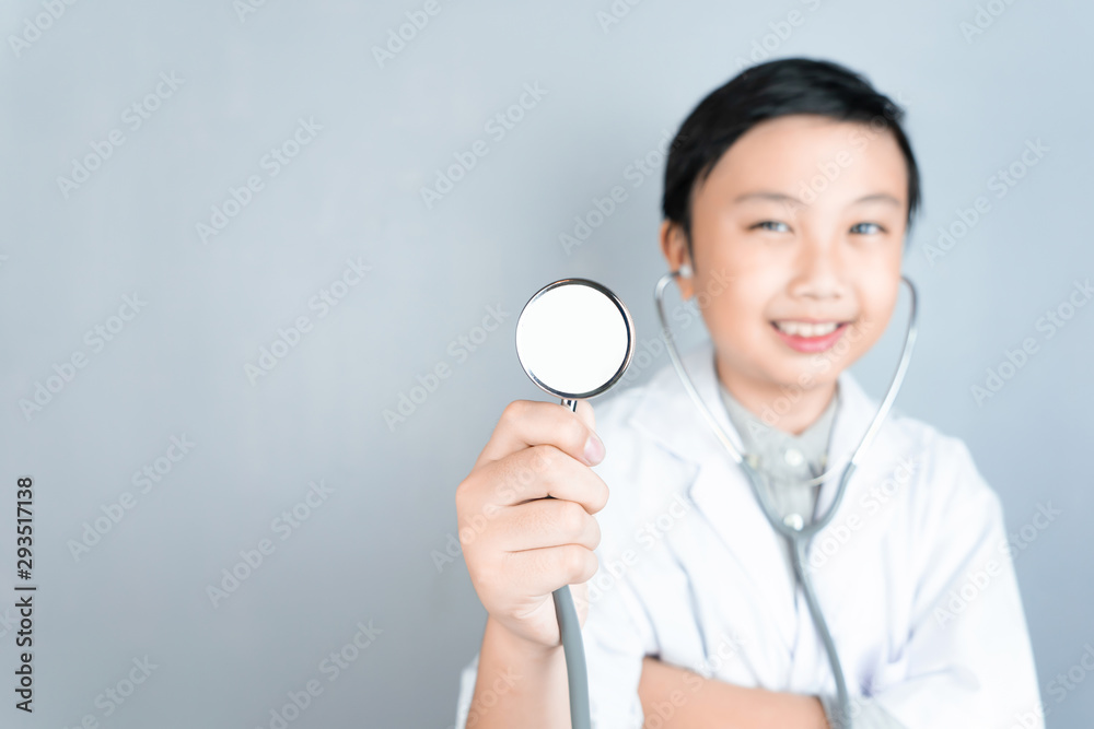 Little boy and stethoscope in doctor uniform with copy space. Little boy and stethoscope in doctor uniform with copy space.