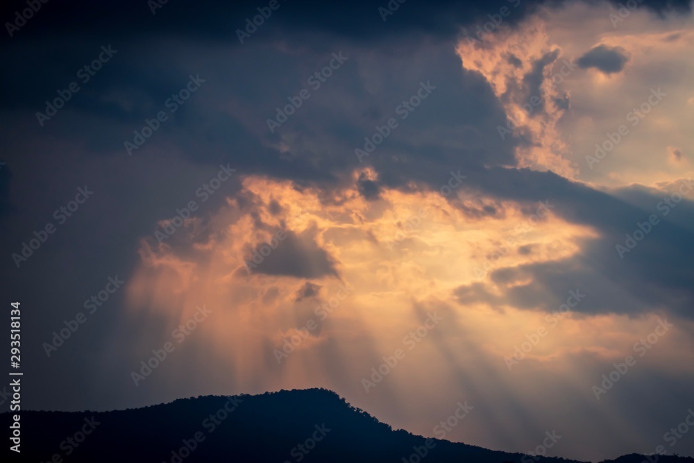 Beautiful natural background, dramatic sky with sunbeams, sun rays shining through the clouds. Soft focus, with copy space. Beautiful natural background, dramatic sky with sunbeams, sun rays shining through the clouds. Soft focus, with copy space.