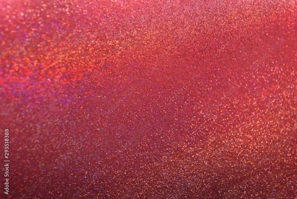 Red terracotta glitter textured background. Bright sparkles and spectrum light pattern.