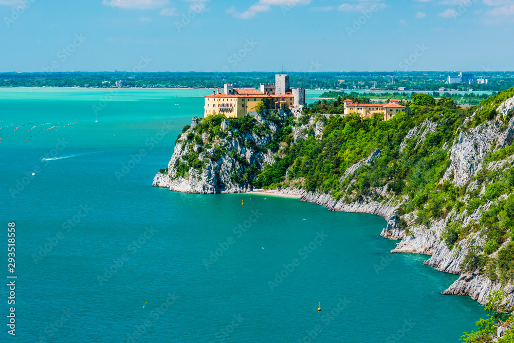 Gulf of Trieste. High cliffs Between boats, karst rocks and ancient castles. Duino. Italy