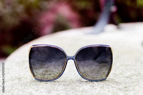 Close up with fashionable sunglasses outdoor