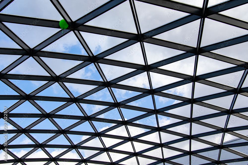 Glass roof against the blue sky. Glass roof against the blue sky.