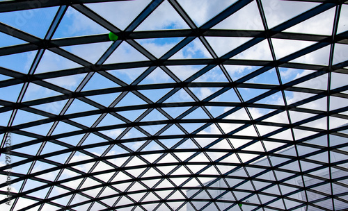 Glass roof against the blue sky.