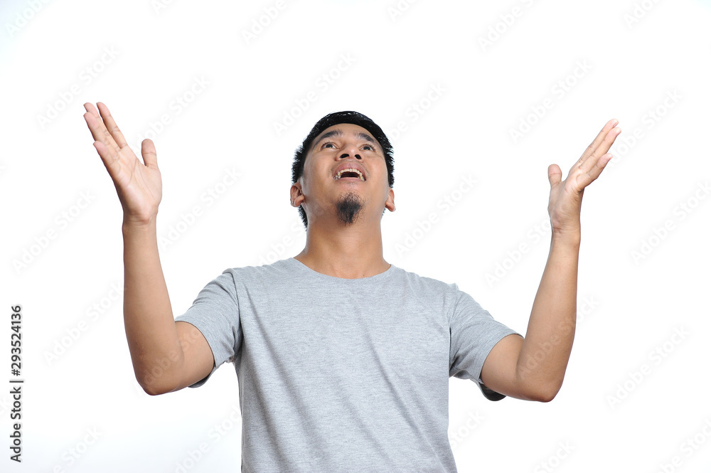 Happy asian man with surprised expression Happy asian man with surprised expression