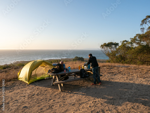 Father and son at campsite in Montana de Oro State Park, Los Osos, California, USA