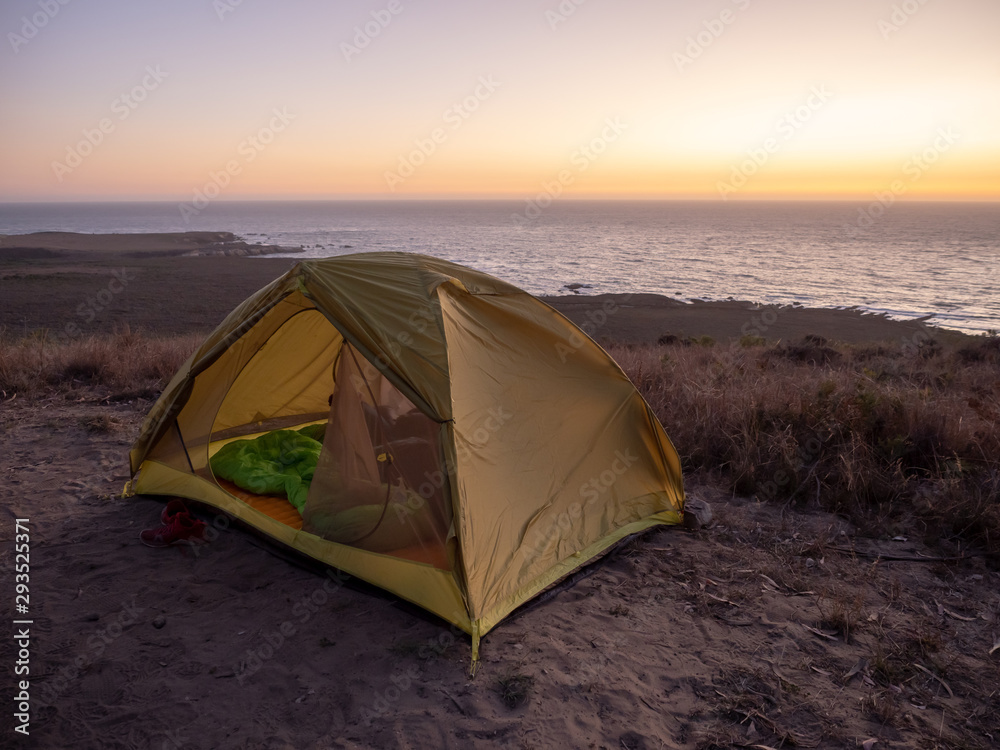 Tent campsite on bluff over ocean at sunset in Montana de Oro State Park, Los Osos, California, USA