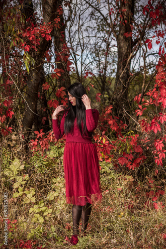 Autumn golden time  portrait of fashionable woman wear marsala dress   scene at park outdoors