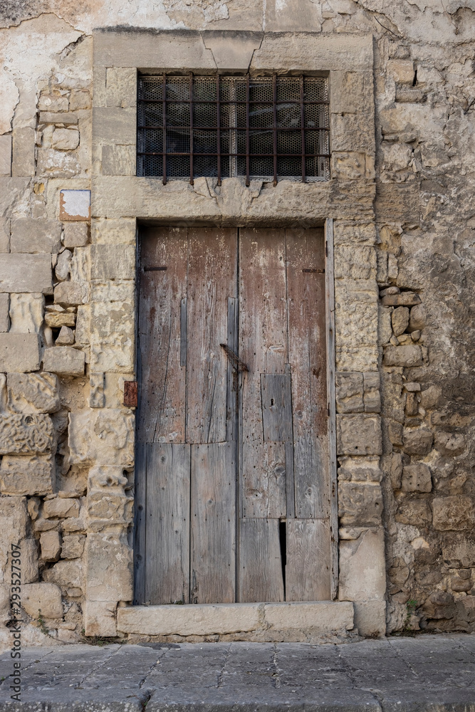 old Italian palace door in ruined wood