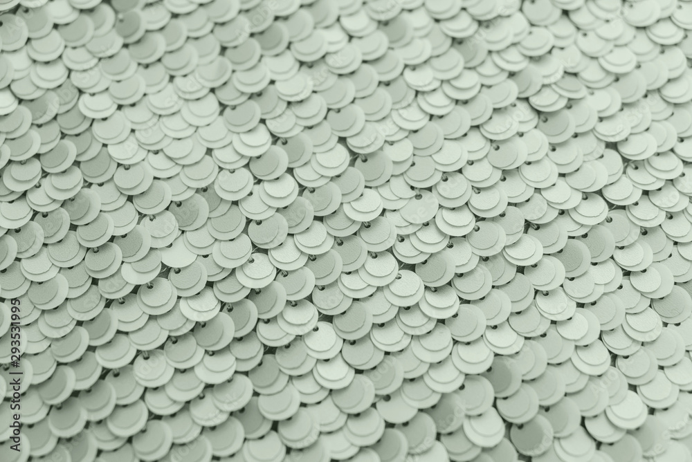 Mint tranquil green shiny fabric with sequins, abstract background.