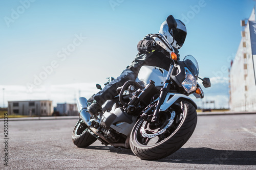 biker rides motorcycle, turns, bright colors motorcycle, sports fast motorcycle