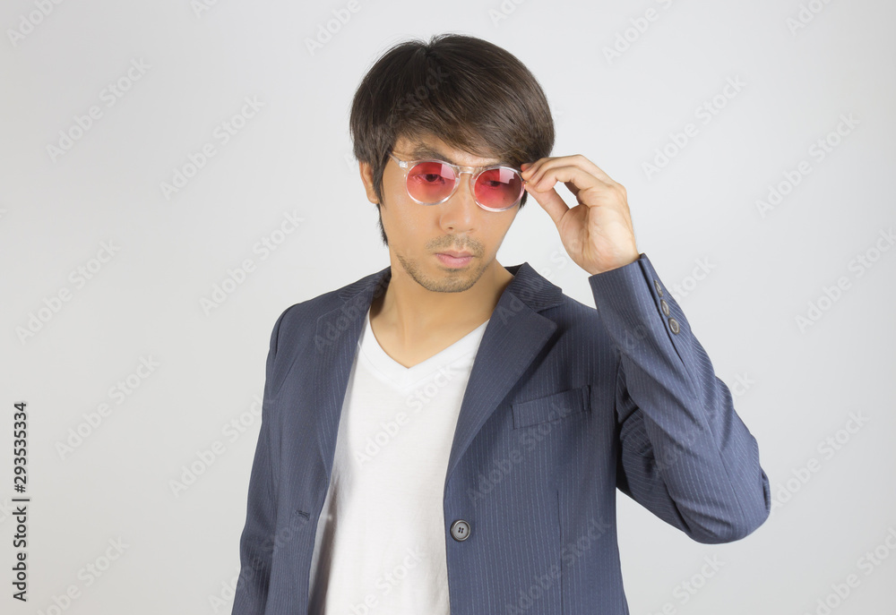 Portrait Asian Casual Businessman in Suit Touching Red Eyeglasses Portrait Asian Casual Businessman in Suit Touching Red Eyeglasses