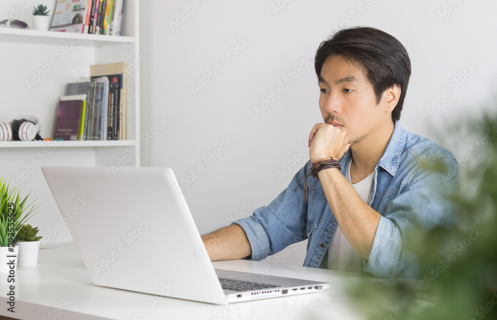 Portrait Asian Casual Businessman Use Laptop and Thinking and Serious Pose Portrait Asian Casual Businessman Use Laptop and Thinking and Serious Pose