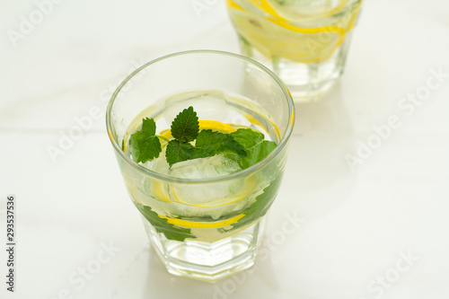 glass of water with lemon and mint
