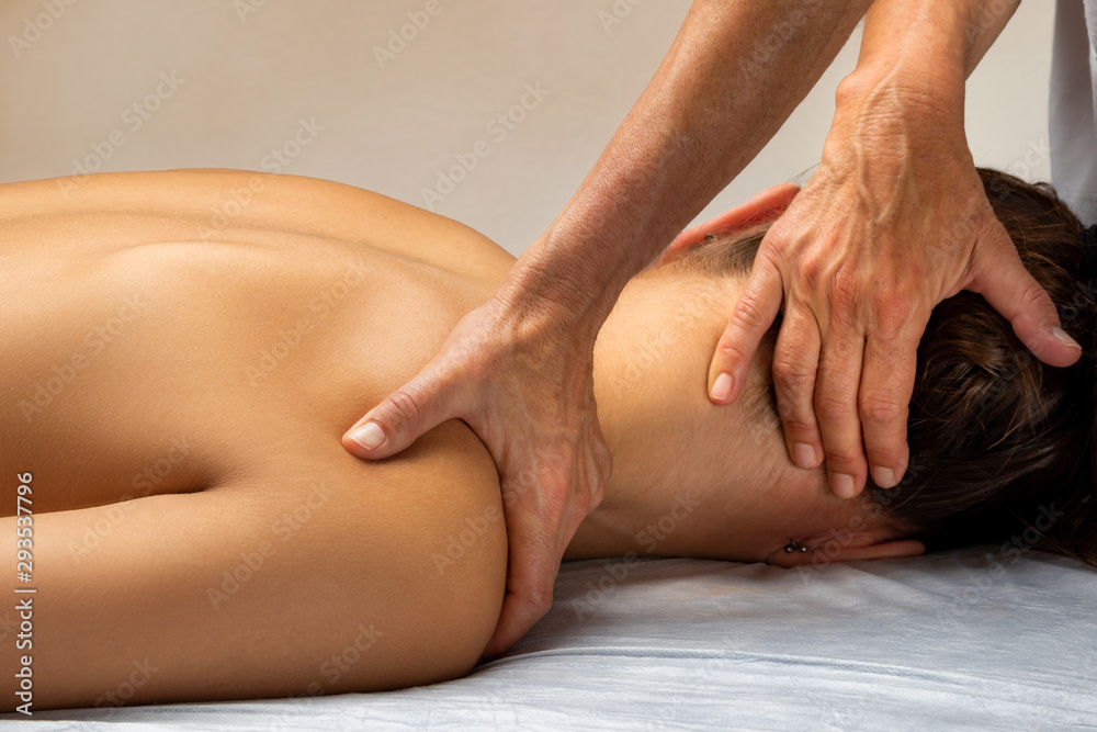 Hands manipulating cervical spine on woman. Hands manipulating cervical spine on woman.