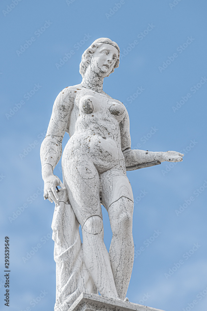 Roof statue of a beautiful Renaissance Era naked woman at Old Library of Saint Marco (Marciana) in Venice, Italy Roof statue of a beautiful Renaissance Era naked woman at Old Library of Saint Marco (Marciana) in Venice, Italy