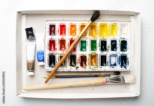 Set watercolor paints with paintbrush. Art concept