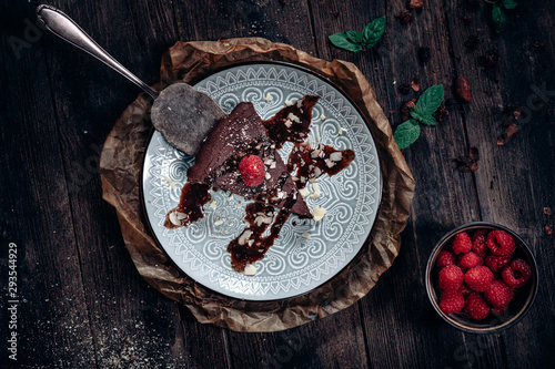 Chocolate cake with rasberry, mint and cocoa seeds