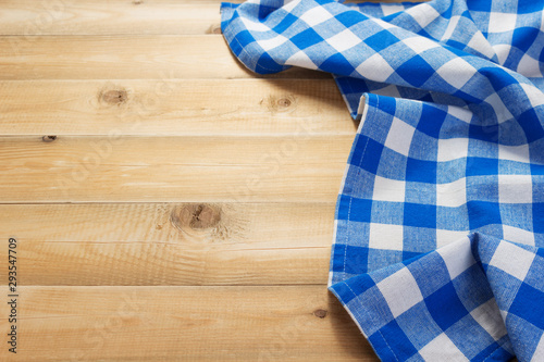 cloth napkin at rustic table in front,