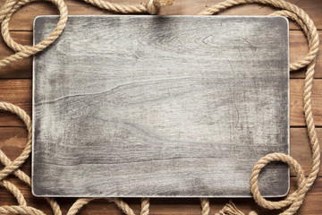 ship rope at wooden board background