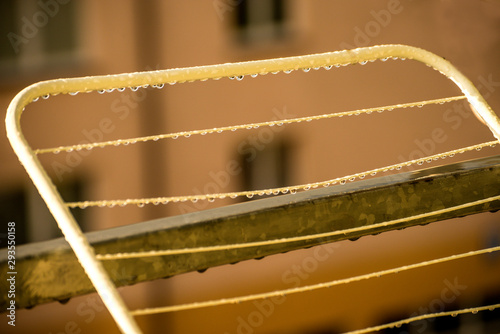 drying rack on a balcony with raindrops