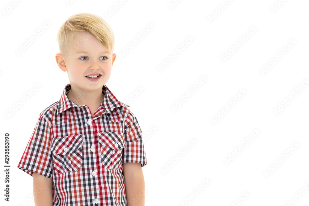 A cute little boy in a shirt and shorts. A cute little boy in a shirt and shorts.