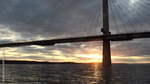 4K Video of sunset in North Queensferry near Edinburgh and Queensferry Crossing Bridge. North Queensferry is located ten miles west of the center of Edinburgh in Scotland. Full hd video.