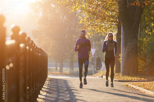 Runners fitness couple jogging in the morning