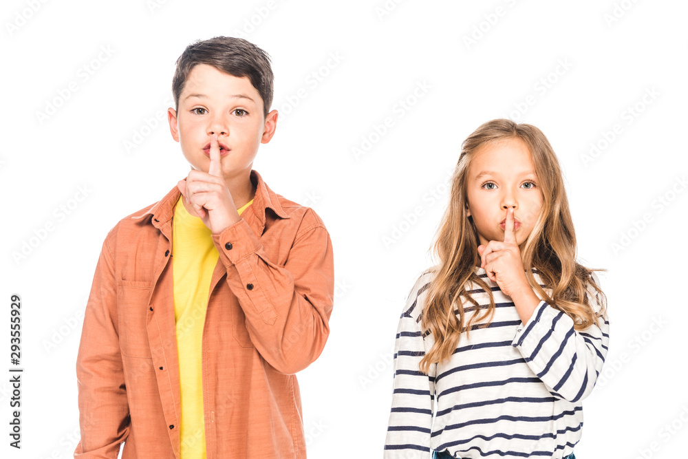 front view of two kids showing signs isolated on white front view of two kids showing signs isolated on white