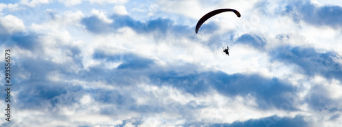 Billede på lærred silhouette of skydiver with parachute - live your dream, freedom and adrenaline
