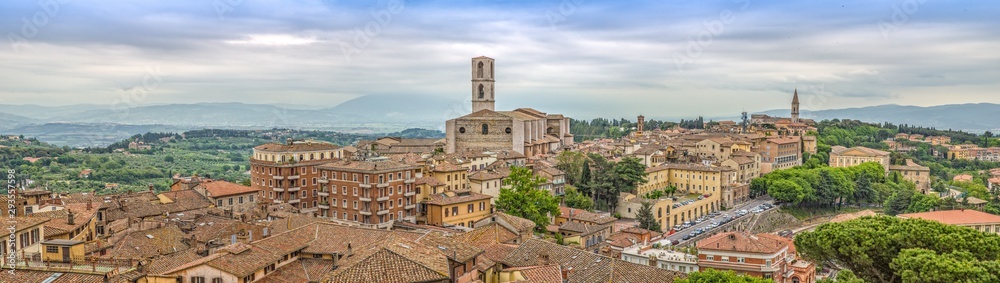 Perugia is a lively medieval walled hill town.Panoramic view of Perugia with basilica of San Domenico and with historic buildings, Umbria, Italy