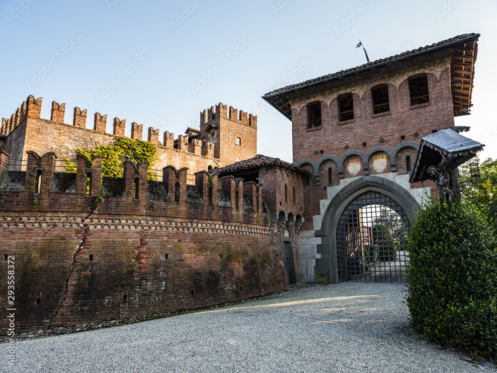 Old town and old castle in Italy with blue sky and entrance to the castle